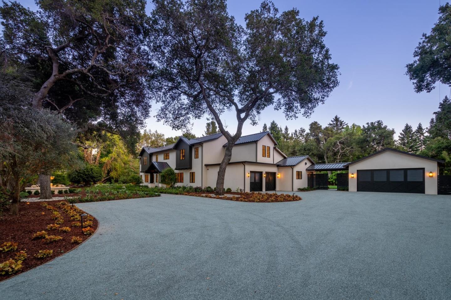 52 Middlefield Road Atherton, CA 94027 - Photo 2 of 45 a front view of a house with a garden and trees
