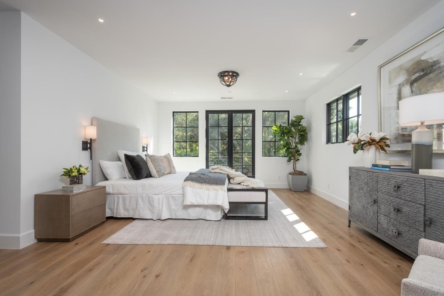 52 Middlefield Road Atherton, CA 94027 - Photo 22 of 45 a spacious bedroom with a large bed and a couch