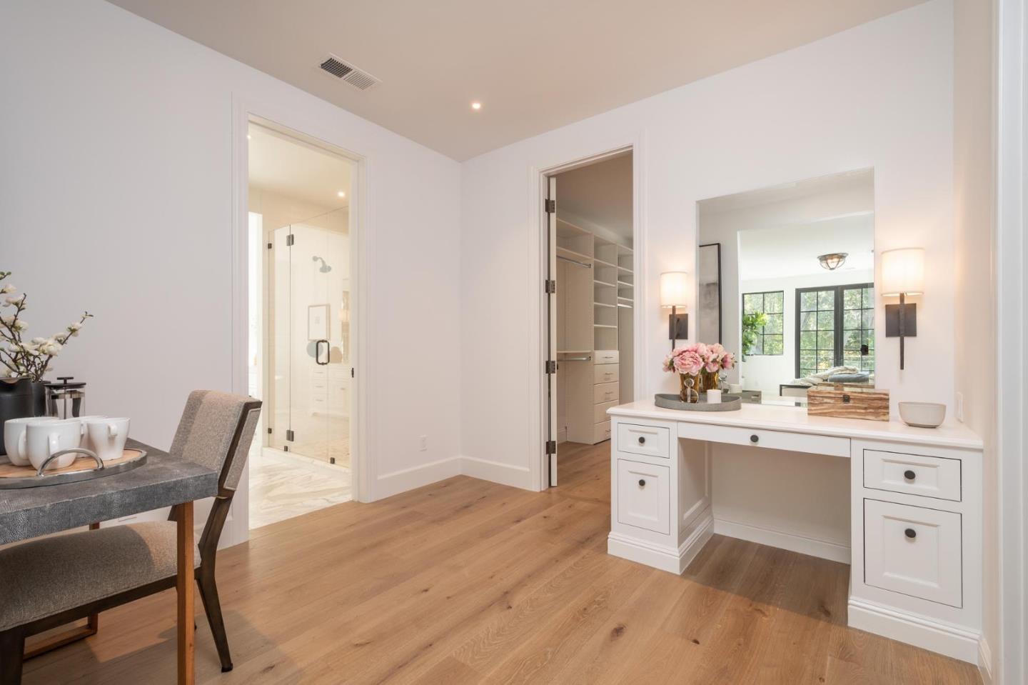 52 Middlefield Road Atherton, CA 94027 - Photo 24 of 45 a room with stainless steel appliances kitchen island a table and chairs in it