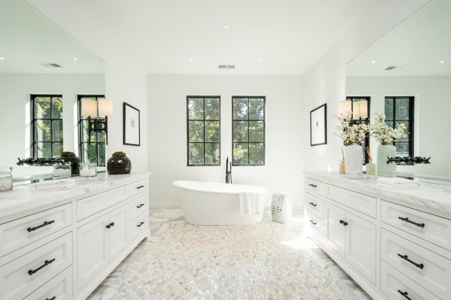 52 Middlefield Road Atherton, CA 94027 - Photo 25 of 45 a spacious bathroom with double vanity a window a mirror and a bathtub
