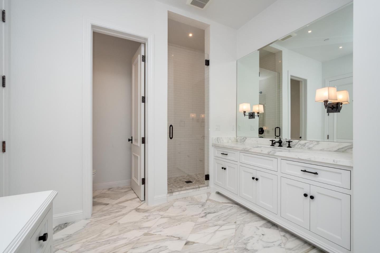 52 Middlefield Road Atherton, CA 94027 - Photo 29 of 45 a bathroom with a granite countertop sink mirror and a