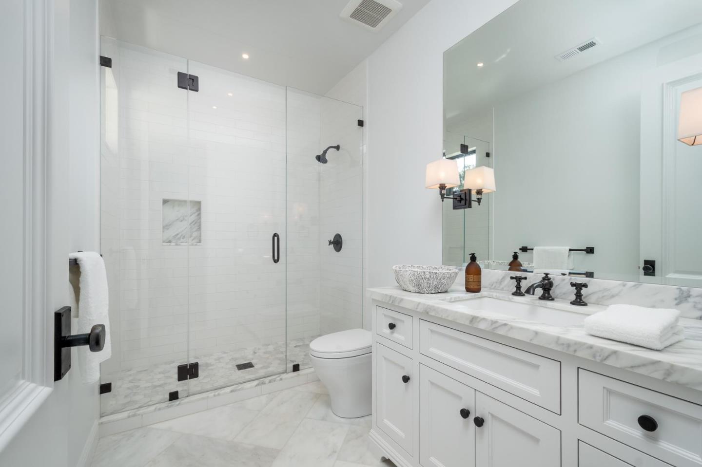 52 Middlefield Road Atherton, CA 94027 - Photo 31 of 45 a bathroom with a double vanity sink toilet and shower