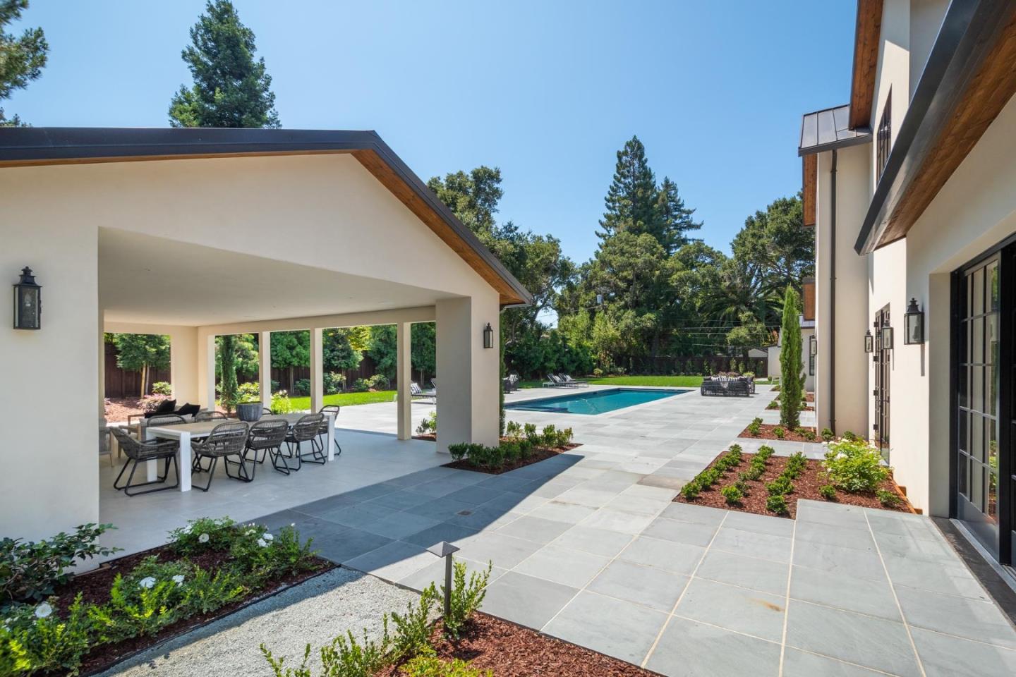 52 Middlefield Road Atherton, CA 94027 - Photo 35 of 45 a view of a house with backyard sitting area and garden