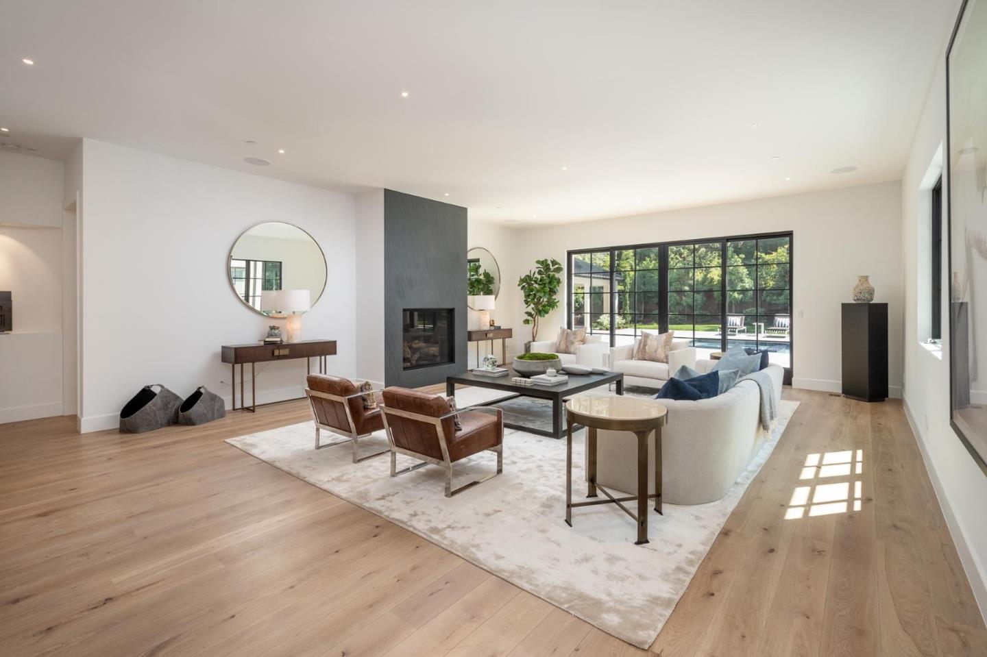 52 Middlefield Road Atherton, CA 94027 - Photo 8 of 45 a living room with fireplace furniture and a large window