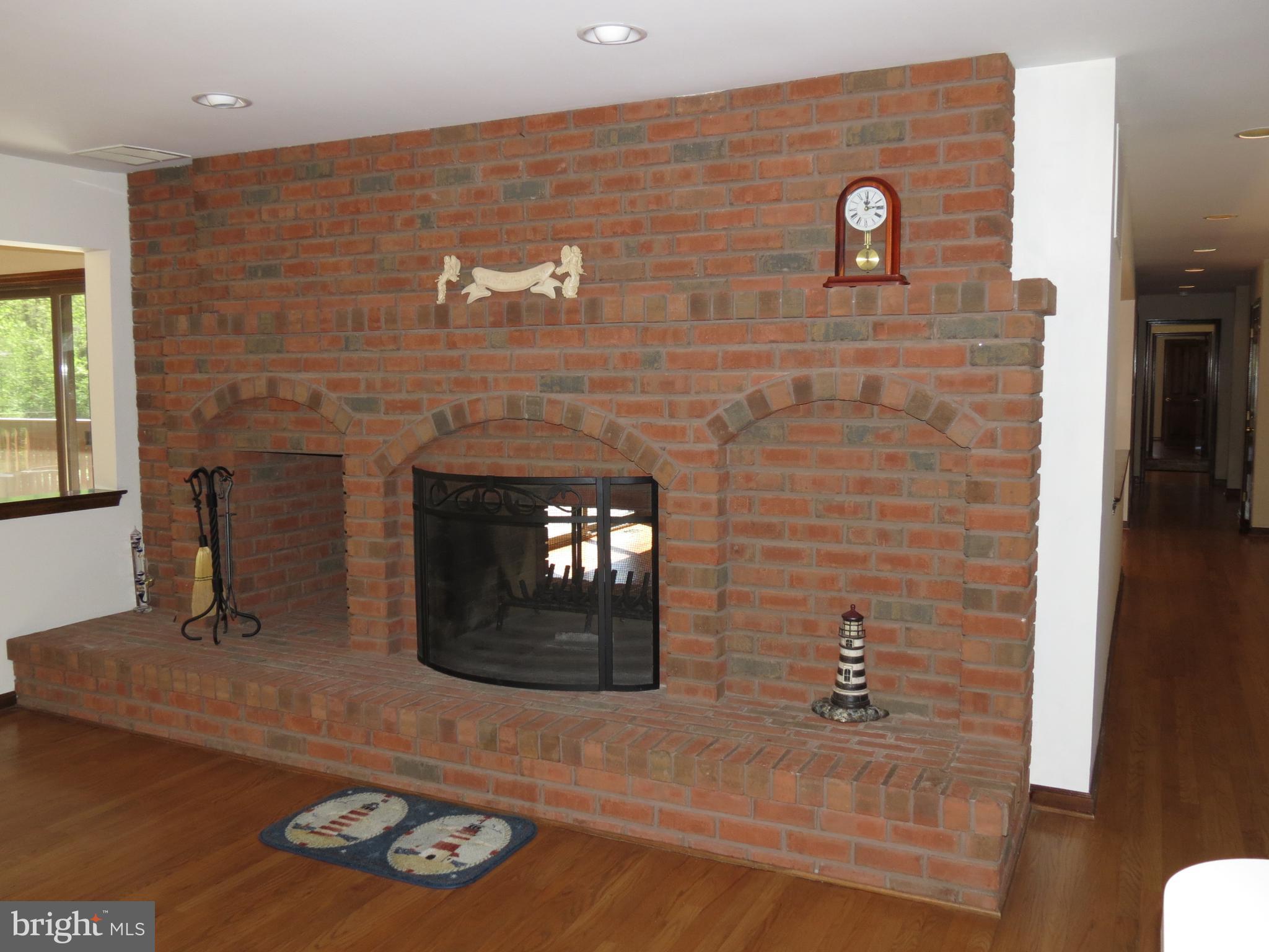 236 Jewell Road Dunkirk, MD 20754 - Photo 9 of 29 Two sided fireplace in kitchen