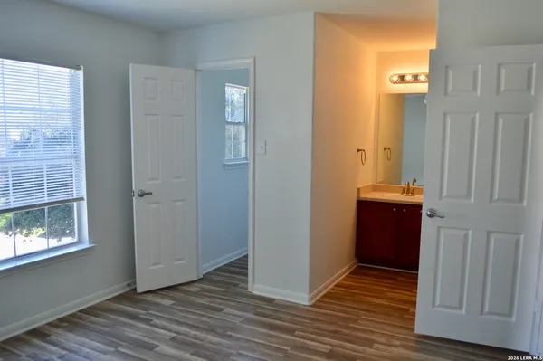 an empty room with windows and entrance