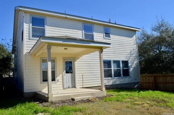 a view of front of house with a yard