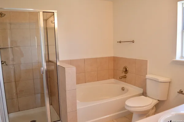 a bathroom with a toilet and a bathtub