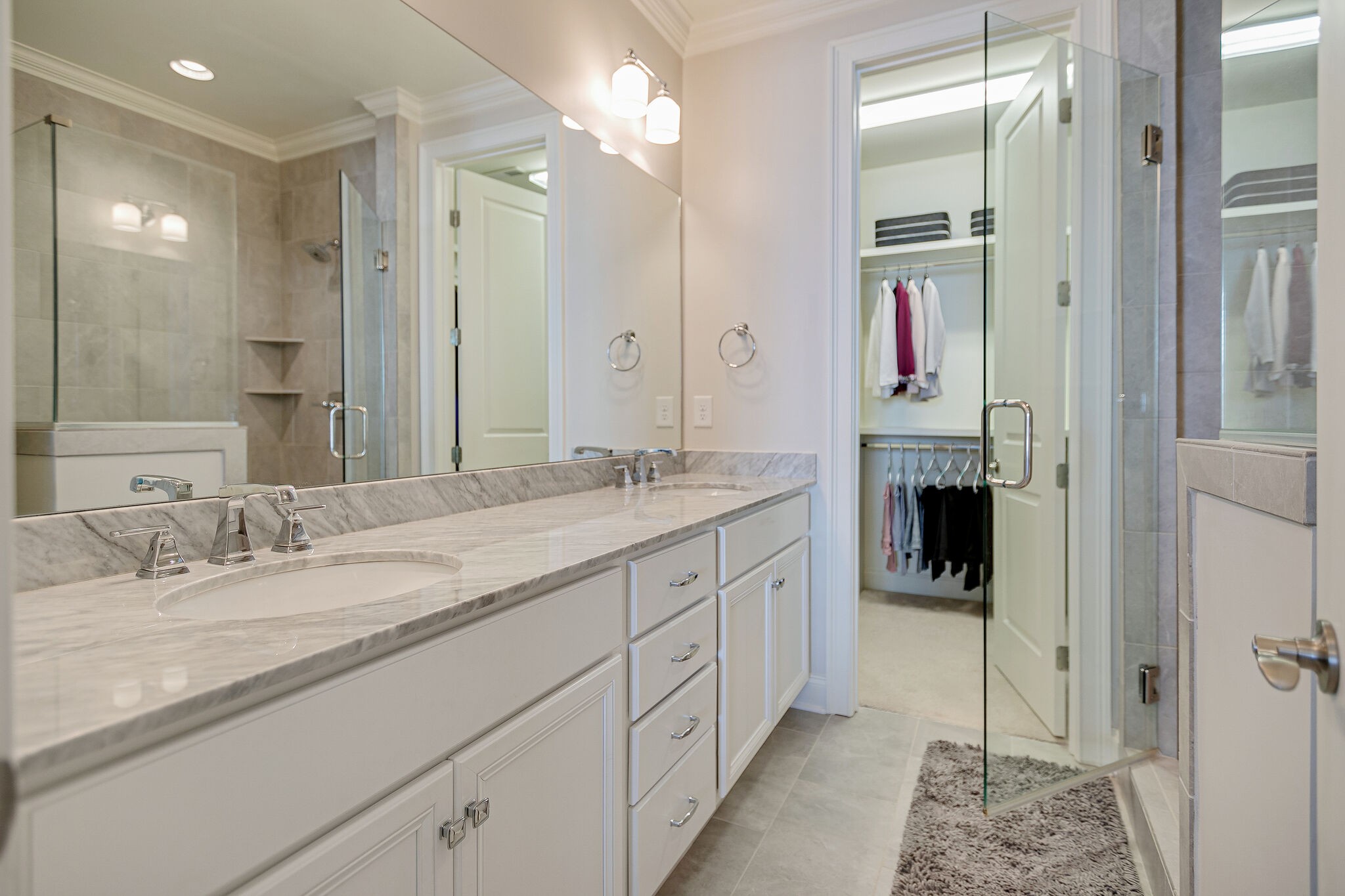 413 Courfield Drive Franklin, TN 37064 - Photo 15 of 27 a spacious bathroom with a shower sink and mirror