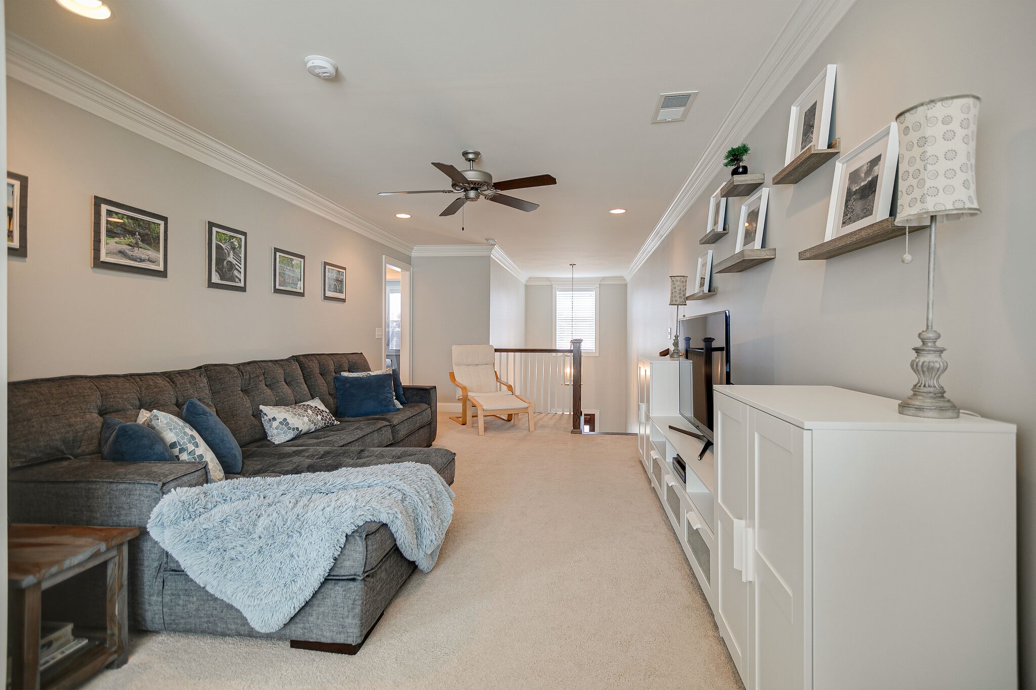 413 Courfield Drive Franklin, TN 37064 - Photo 18 of 27 a living room with furniture and a chandelier