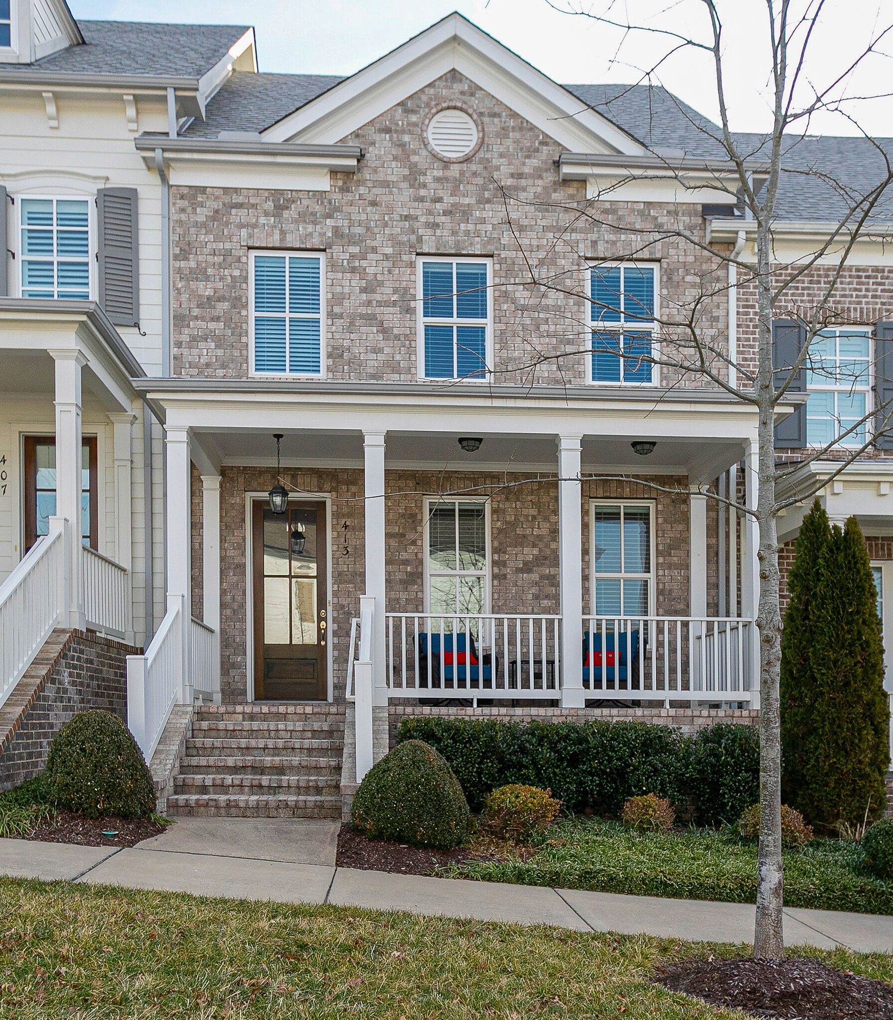 413 Courfield Drive Franklin, TN 37064 - Photo 2 of 27 a front view of a house with a yard