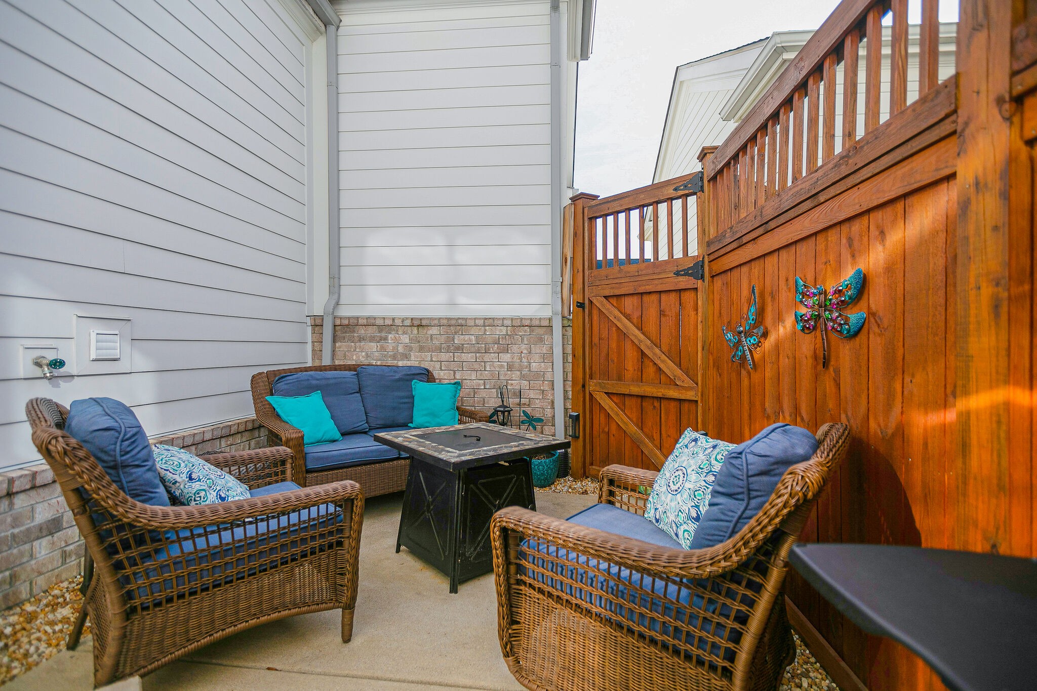413 Courfield Drive Franklin, TN 37064 - Photo 27 of 27 a view of a patio with couches chairs and a wooden floor