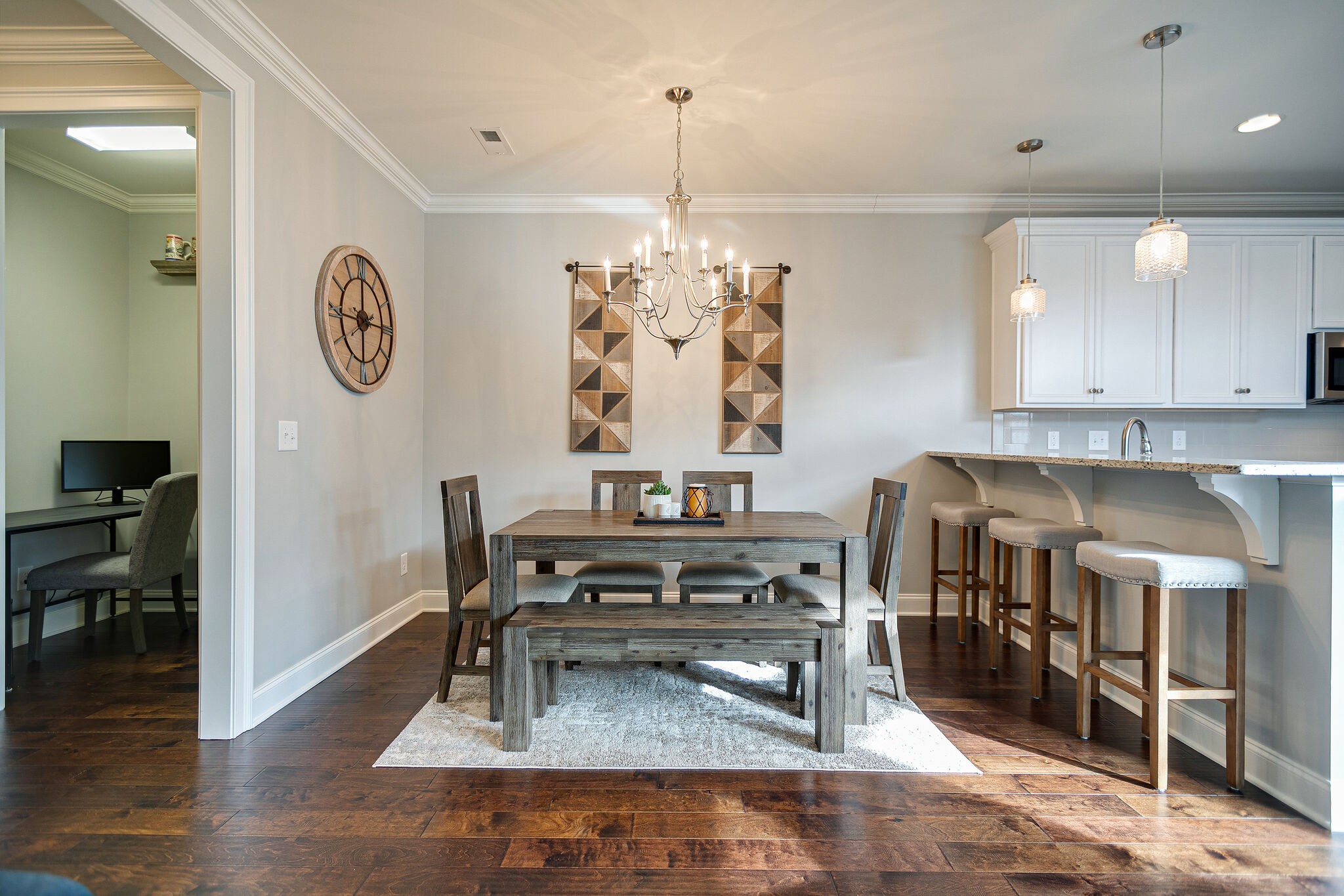 413 Courfield Drive Franklin, TN 37064 - Photo 8 of 27 a kitchen with stainless steel appliances granite countertop a stove a refrigerator and a dining table with wooden floor