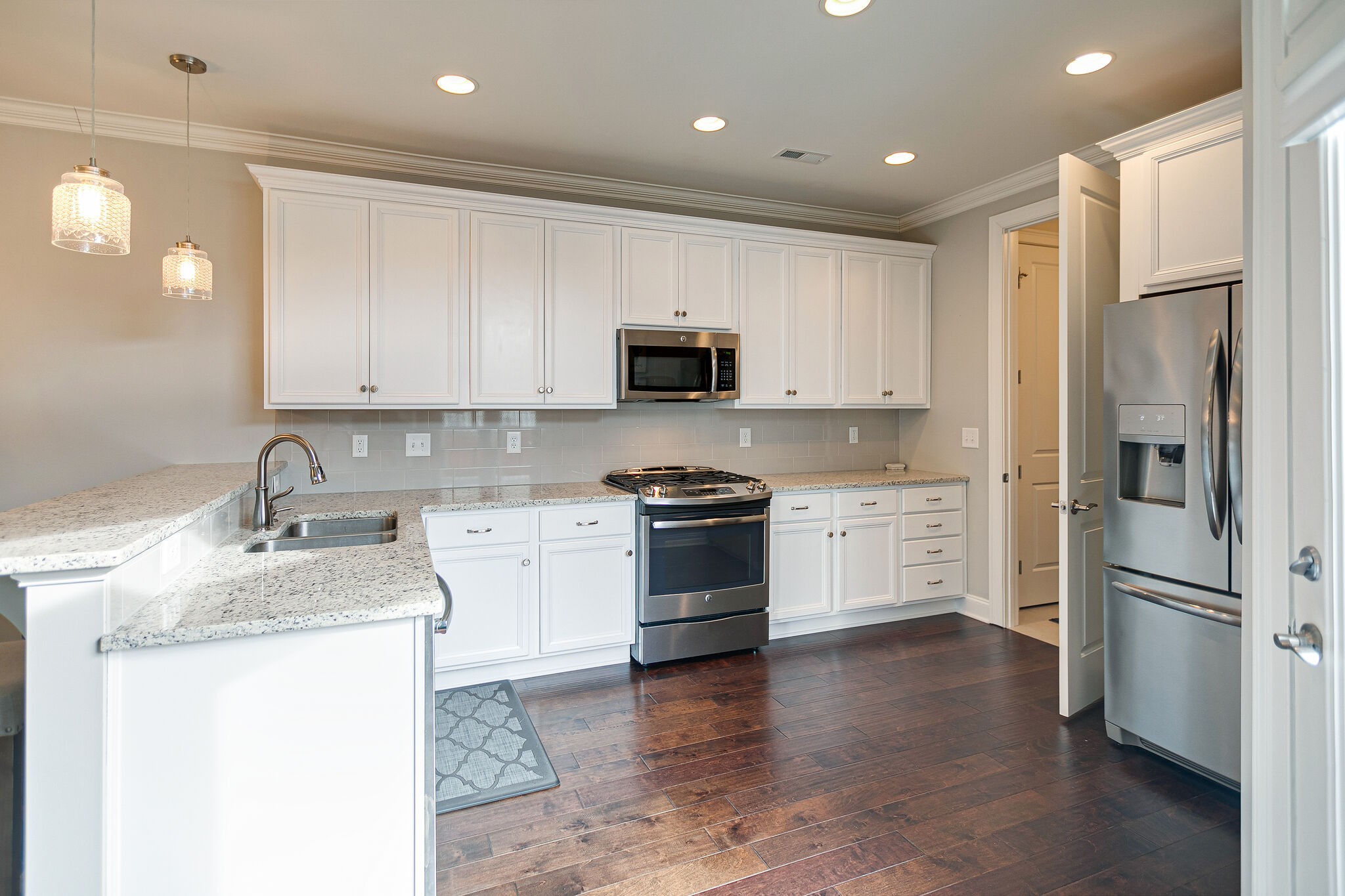 413 Courfield Drive Franklin, TN 37064 - Photo 10 of 27 a kitchen with a refrigerator stove and microwave