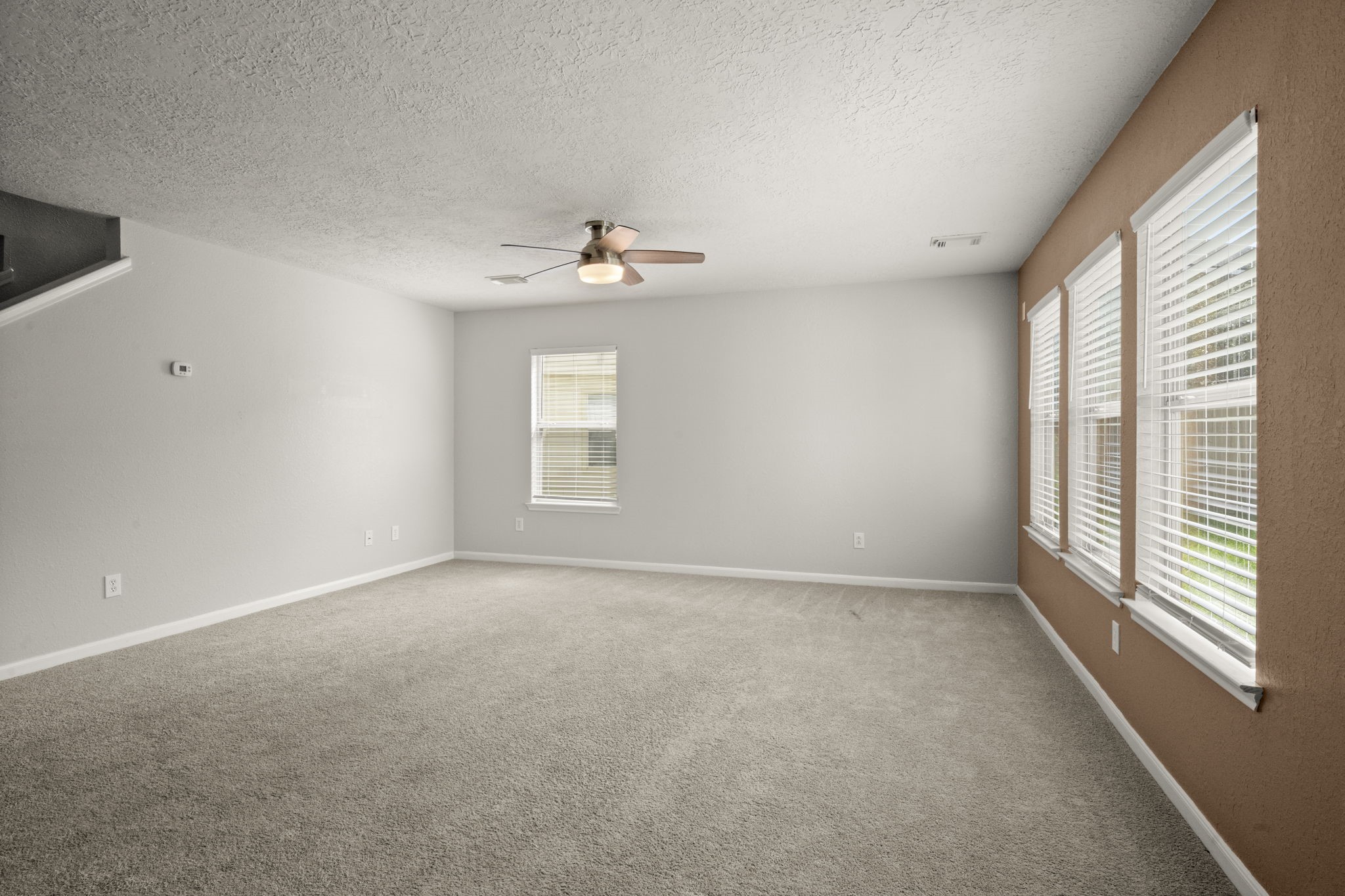 19819 Rippling Brook Lane Tomball, TX 77375 - Photo 12 of 29 a view of an empty room with a window