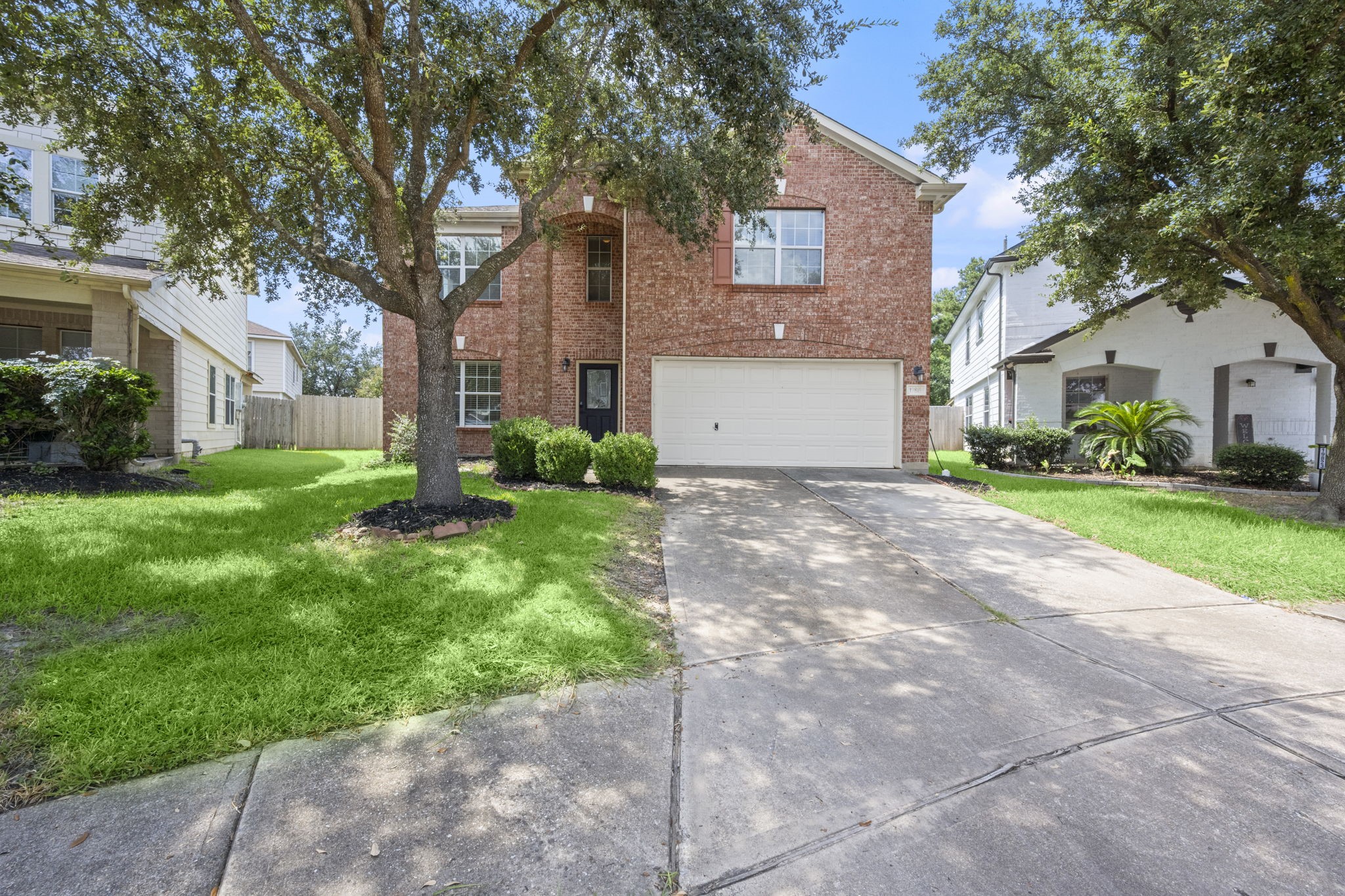 19819 Rippling Brook Lane Tomball, TX 77375 - Photo 2 of 29 a front view of house with yard and green space