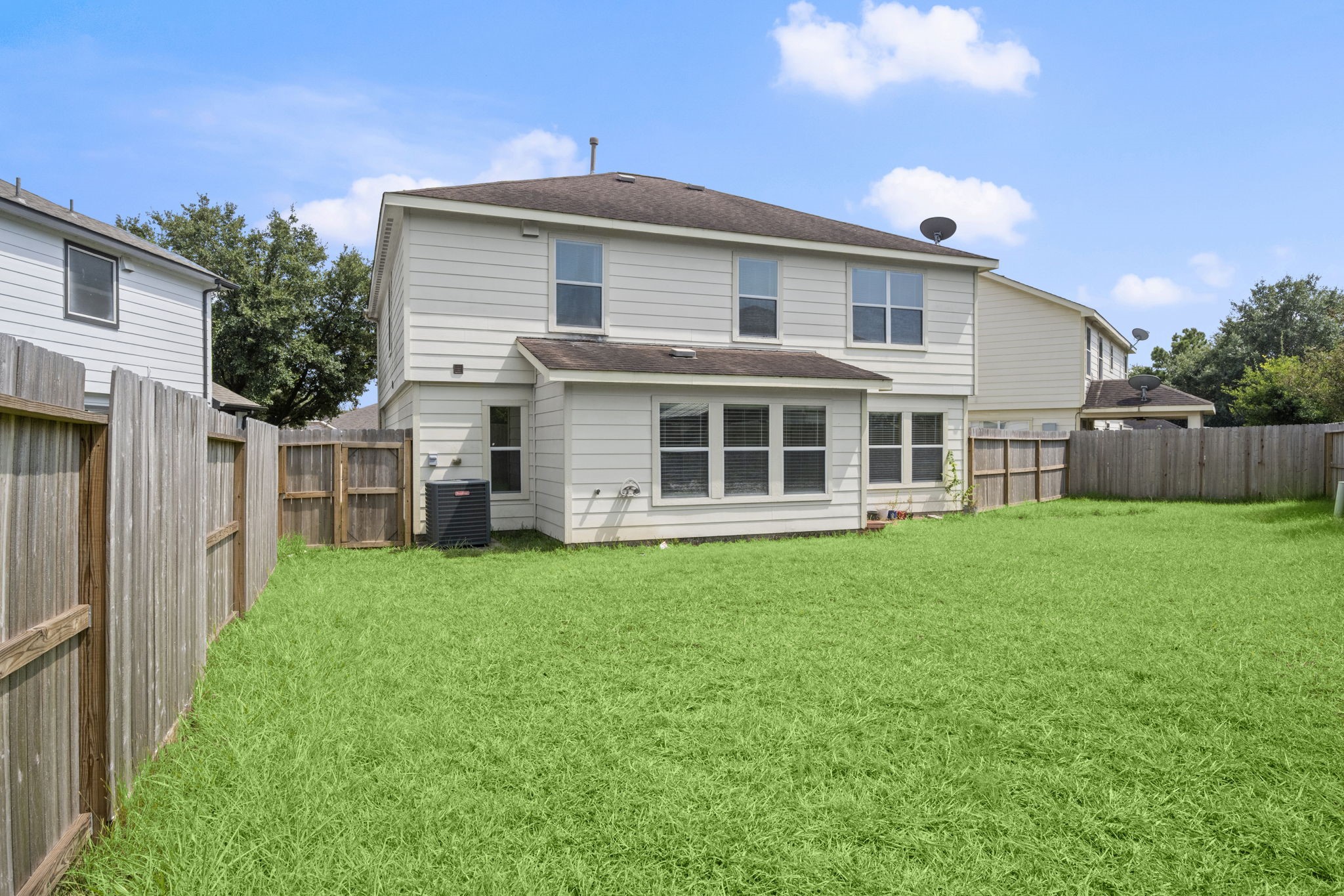 19819 Rippling Brook Lane Tomball, TX 77375 - Photo 27 of 29 a view of an house with backyard space and balcony