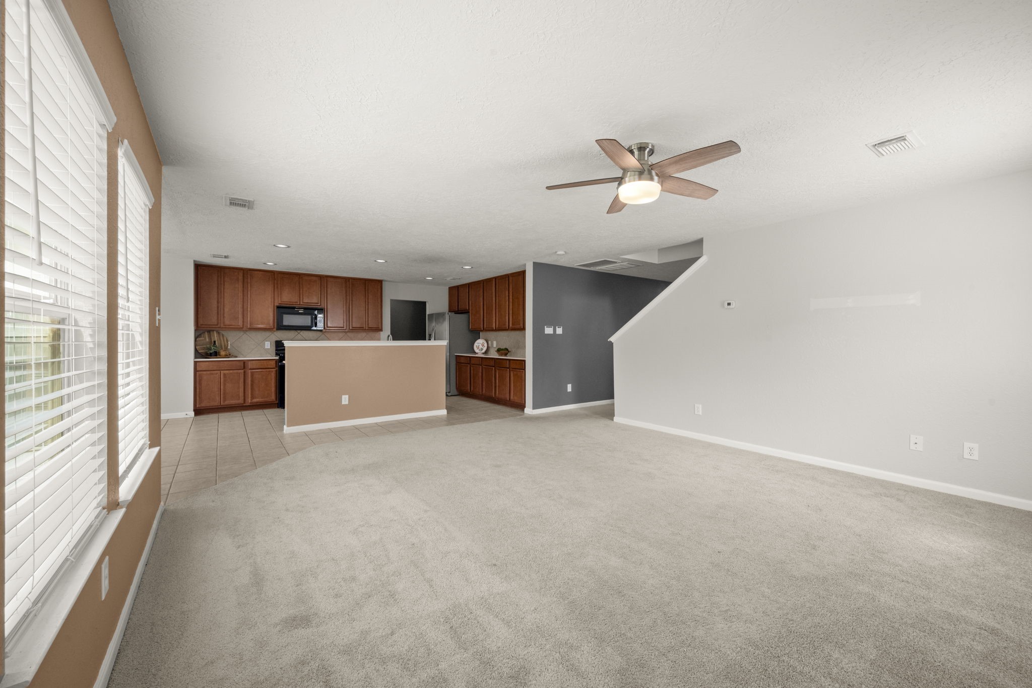 19819 Rippling Brook Lane Tomball, TX 77375 - Photo 9 of 29 a view of a livingroom with a ceiling fan and window