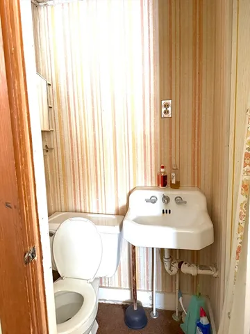 a room with pool table and a window