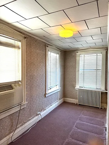 a view of a small space with wooden floor