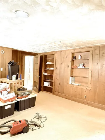 a kitchen with a sink a stove and cabinets