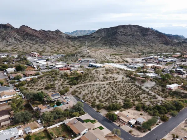 an aerial view of residential house and sandy dunes