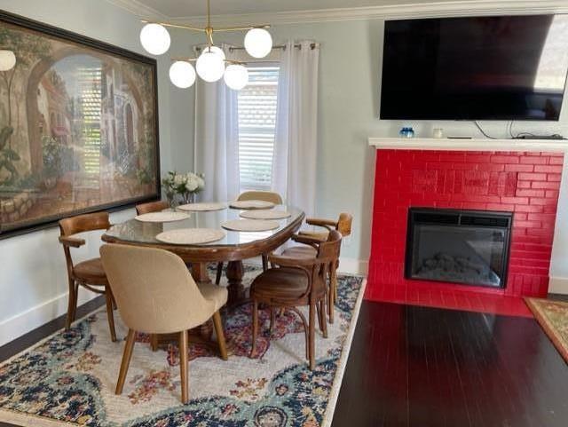 2425 3rd Street Napa, CA 94559 - Photo 13 of 36 a dining room with a flat screen tv and a fireplace