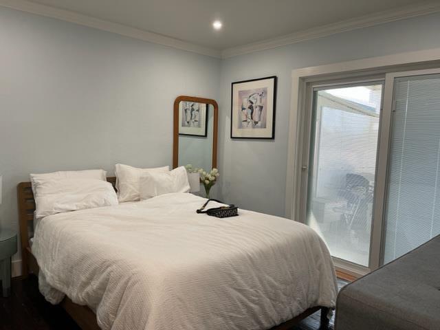 2425 3rd Street Napa, CA 94559 - Photo 28 of 36 a bedroom with a bed and a mirror