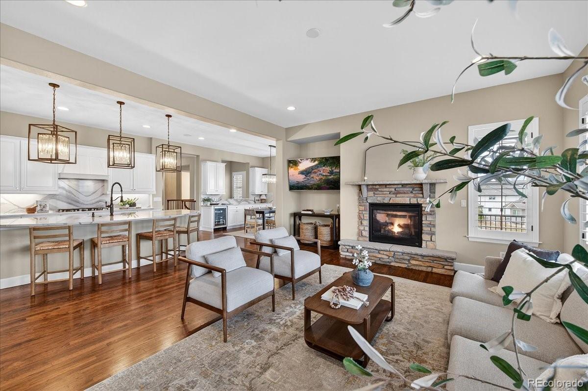 10693 Featherwalk Way Highlands Ranch, CO 80126 - Photo 20 of 50 a living room with furniture and a fireplace