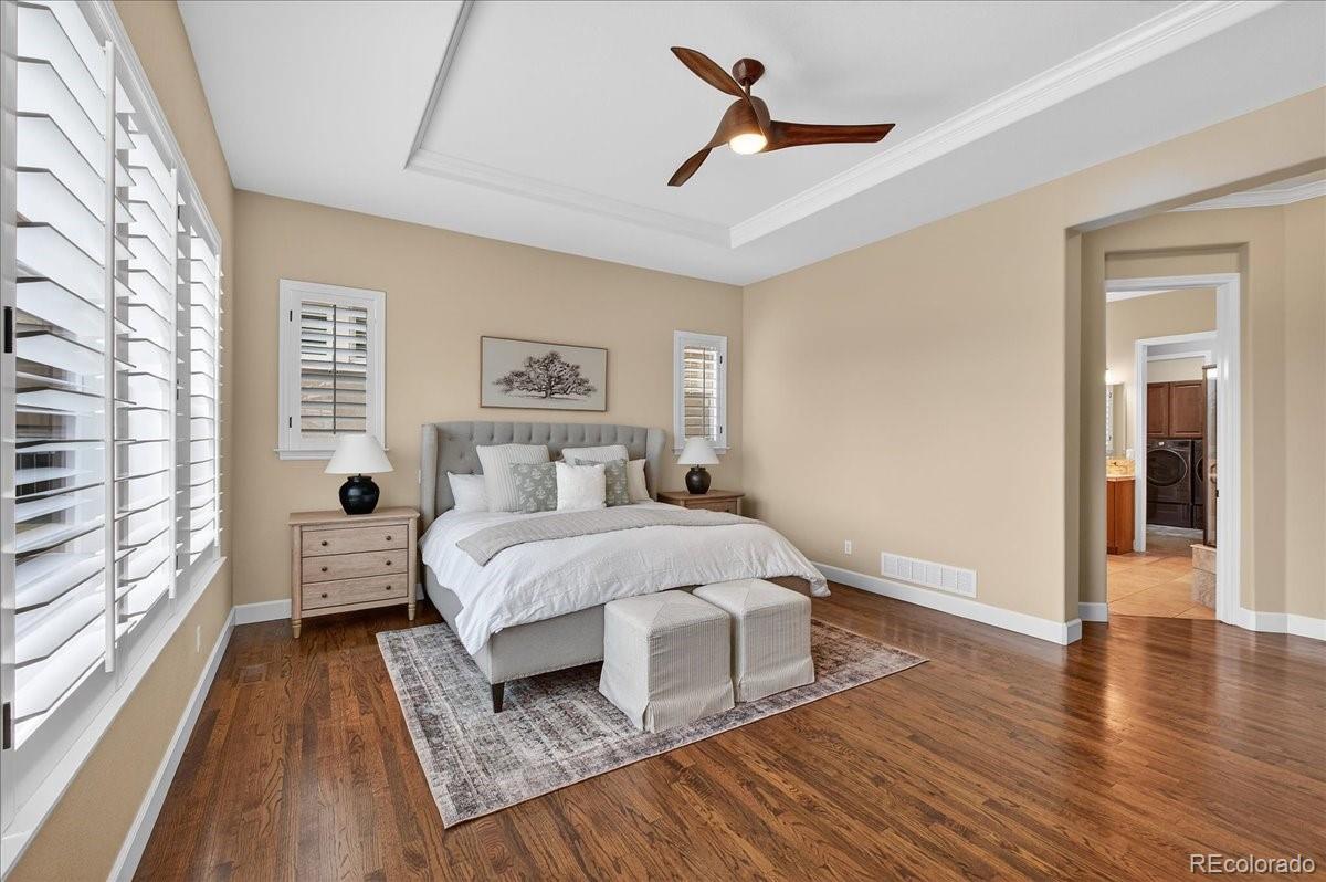 10693 Featherwalk Way Highlands Ranch, CO 80126 - Photo 23 of 50 a bed room with a bed and a window