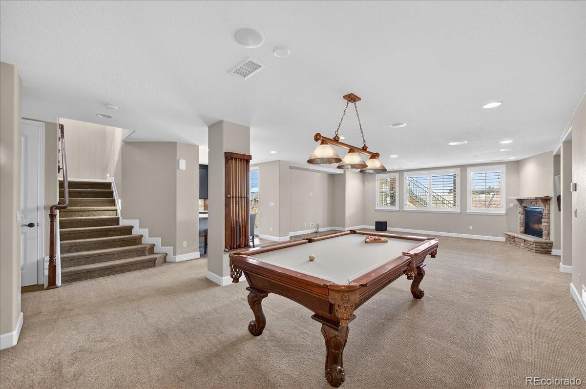 10693 Featherwalk Way Highlands Ranch, CO 80126 - Photo 30 of 50 a room with pool table and window