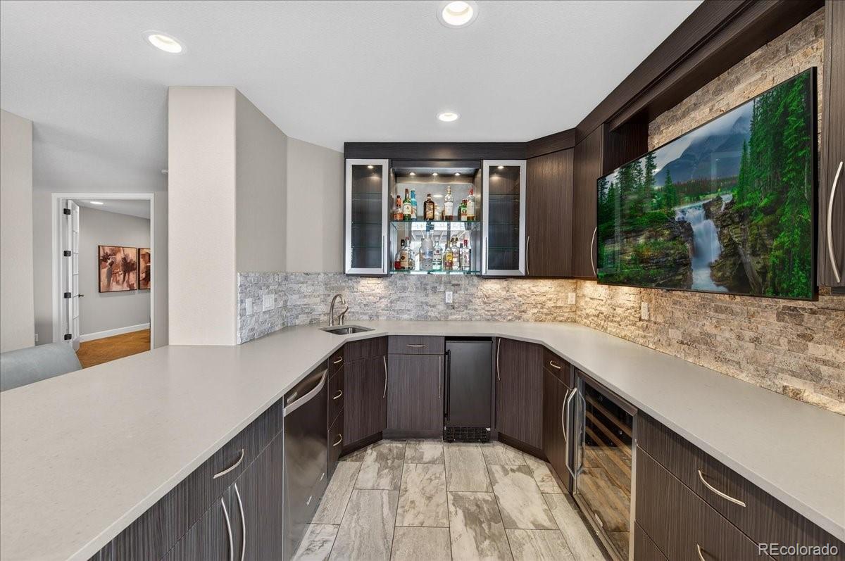 10693 Featherwalk Way Highlands Ranch, CO 80126 - Photo 35 of 50 a kitchen with a sink and large window
