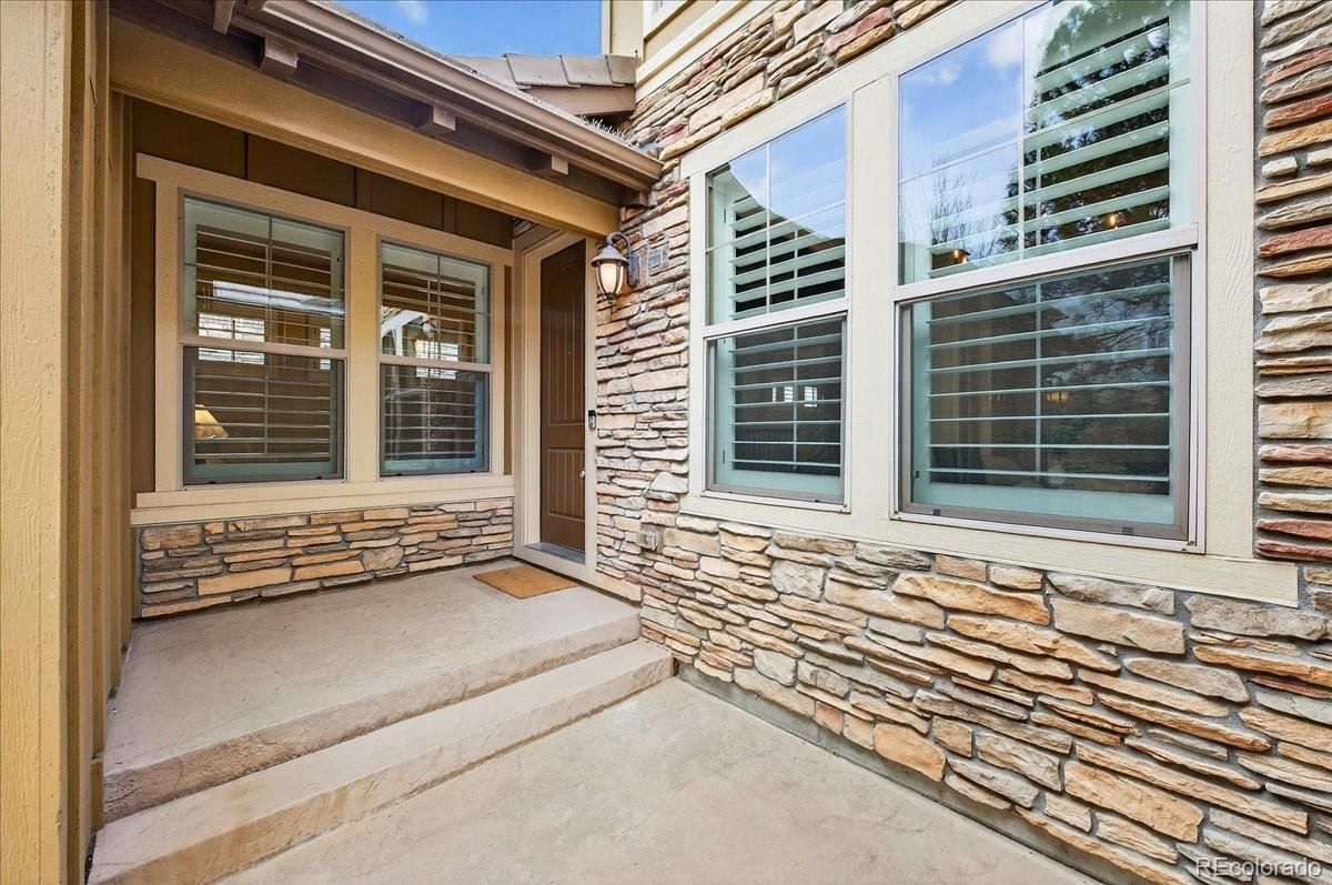 10693 Featherwalk Way Highlands Ranch, CO 80126 - Photo 4 of 50 a front view of a house with a window