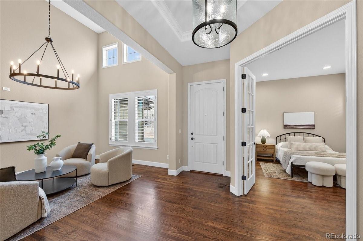 10693 Featherwalk Way Highlands Ranch, CO 80126 - Photo 5 of 50 a living room with furniture and a window