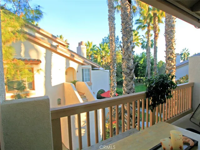 a view of trees from a balcony