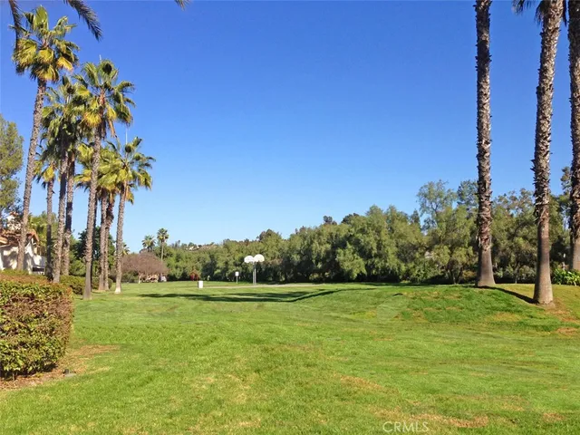 a view of swimming pool with an outdoor seating
