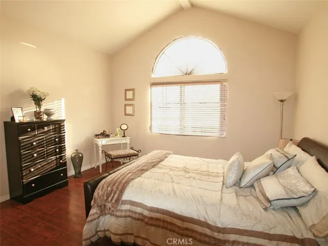 a bedroom with a bed and a dresser