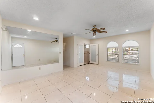 a view of a windows and a chandelier in a room