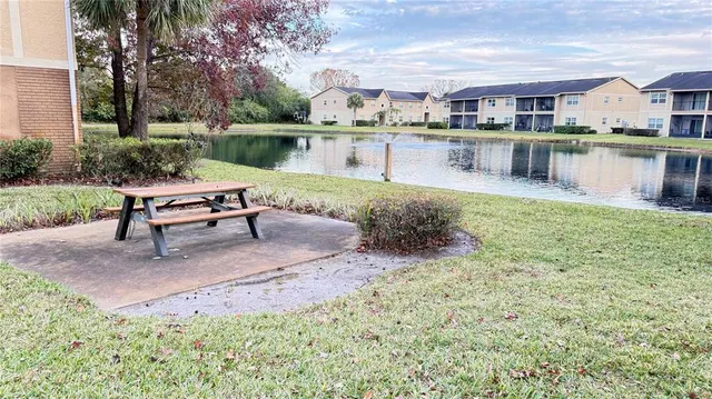 a view of outdoor space with garden and trees