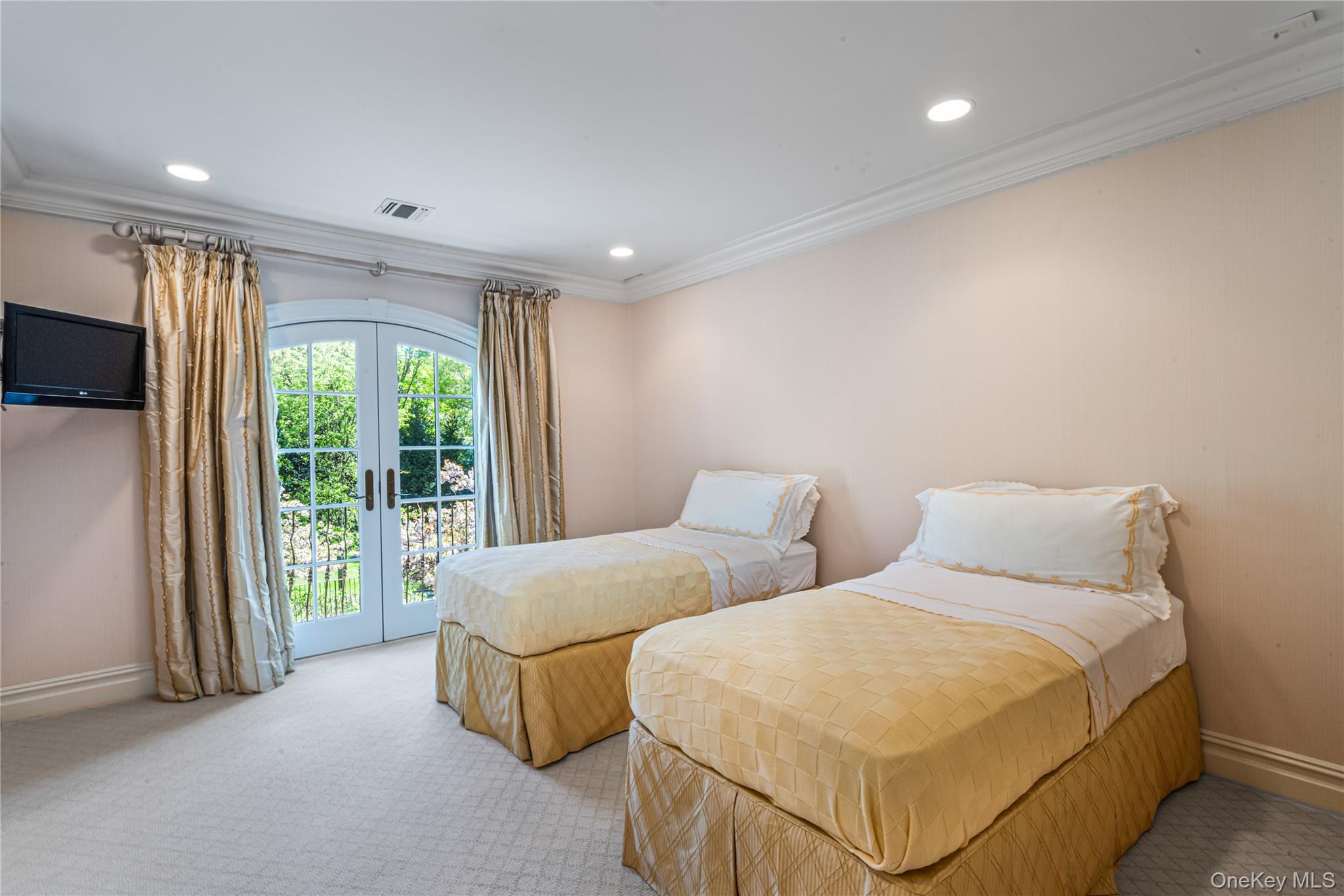 167 Brookville Road Glen Head, NY 11545 - Photo 18 of 31 Bedroom featuring light carpet, access to exterior, french doors, Jack and Jill marble bath