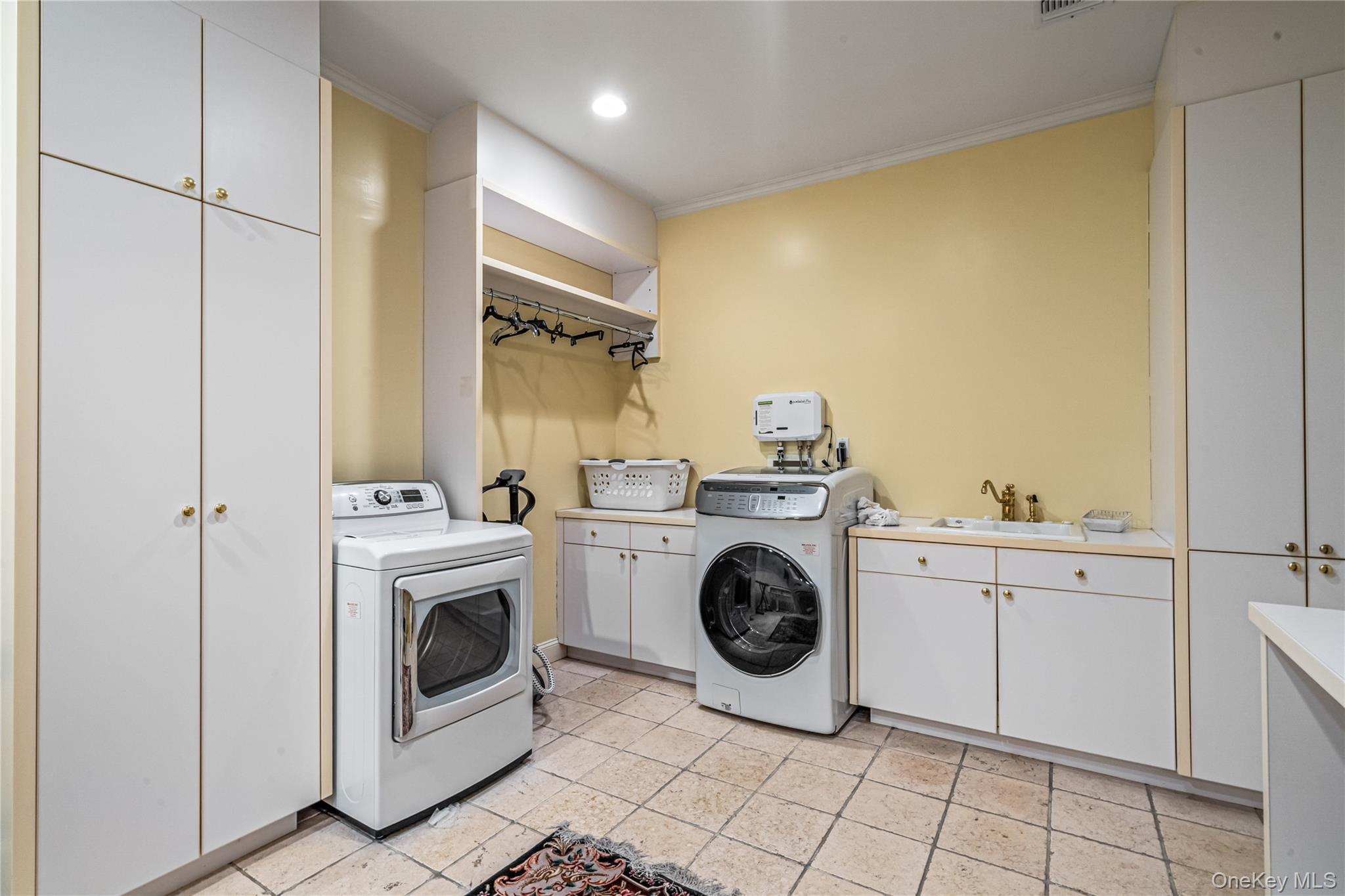 167 Brookville Road Glen Head, NY 11545 - Photo 24 of 31 Laundry area with washer / dryer, cabinet space, and a sink