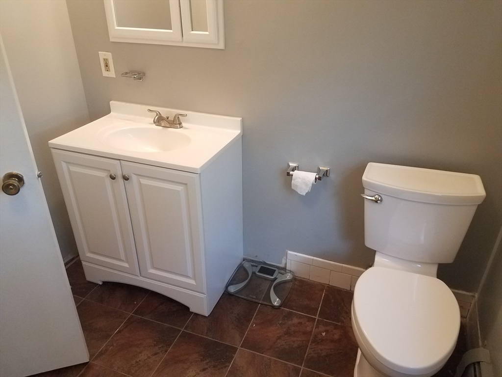 10 Andria Road, Unit 2 Boston, MA 02136 - Photo 4 of 5 a bathroom with a toilet and a sink