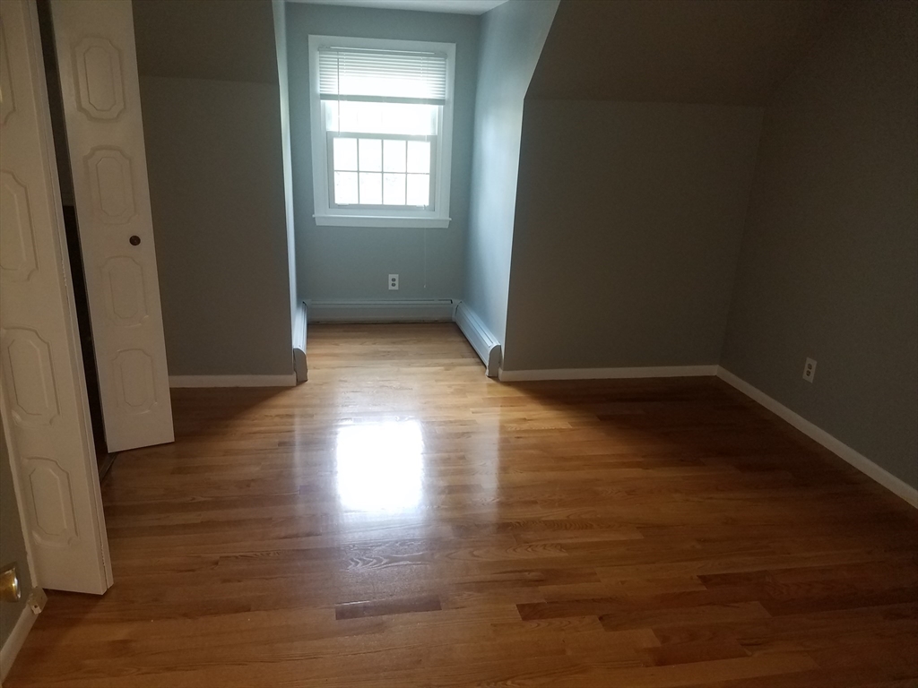 10 Andria Road, Unit 2 Boston, MA 02136 - Photo 5 of 5 a view of a room with wooden floor and window