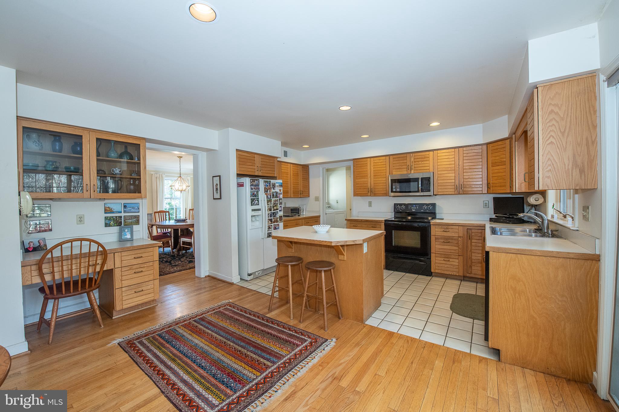 411 Chester Road Devon, PA 19333 - Photo 22 of 48 Open kitchen w island and DR, Laundry/Mud/Gar