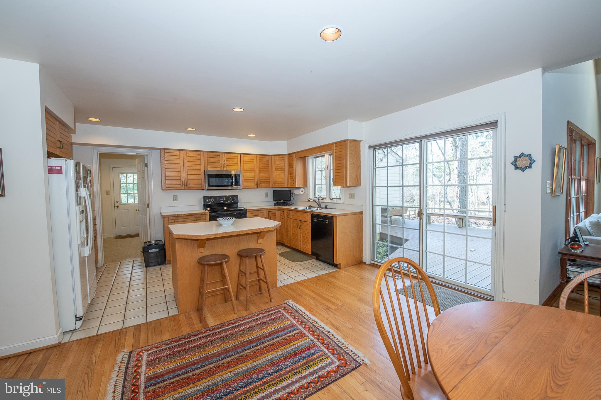 411 Chester Road Devon, PA 19333 - Photo 23 of 48 Sliders to rear deck and breakfast table