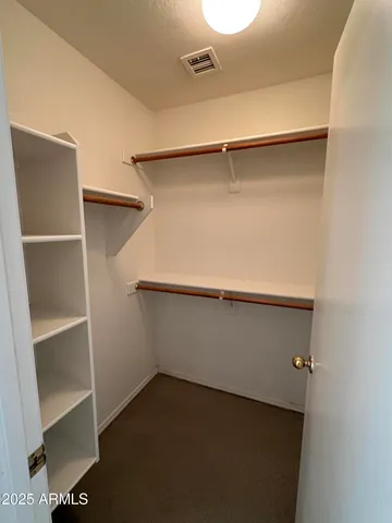 a view of an empty walk in closet
