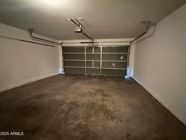 a view of an empty room with a staircase