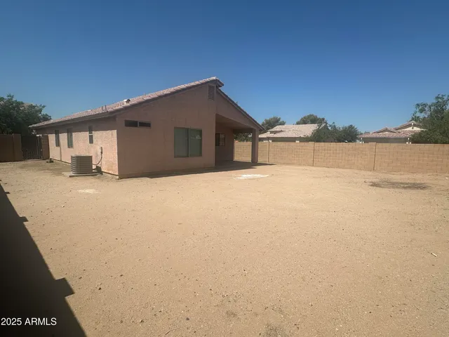 a yellow house with a outdoor space