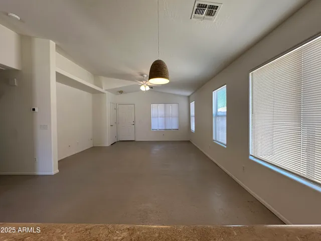 a view of empty room with windows