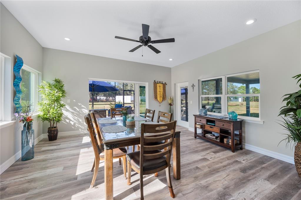 2525 Ranchland Acres Road Lakeland, FL 33809 - Photo 20 of 68 a view of a dining room with furniture window and wooden floor